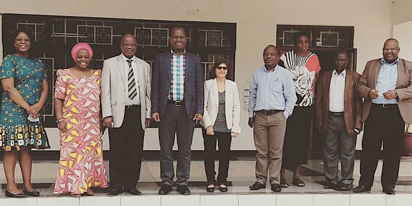 Permanent Secretary, Mr Gerald Kusaya (center), flanked by Emeritus Director Victor Manyong (left) and Director for Eastern Africa, Dr Leena Tripathi (right), with other IITA staff.