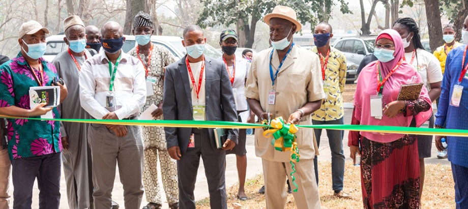 evelopment and Delivery Office Director, Alfred Dixon, cuts the ribbon to kick off the exhibition.