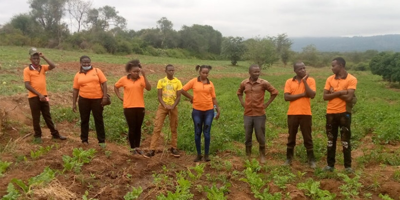 Jonathan Mutinda and Ian Mambo (second and third from right) with youth mentees in Kenya.