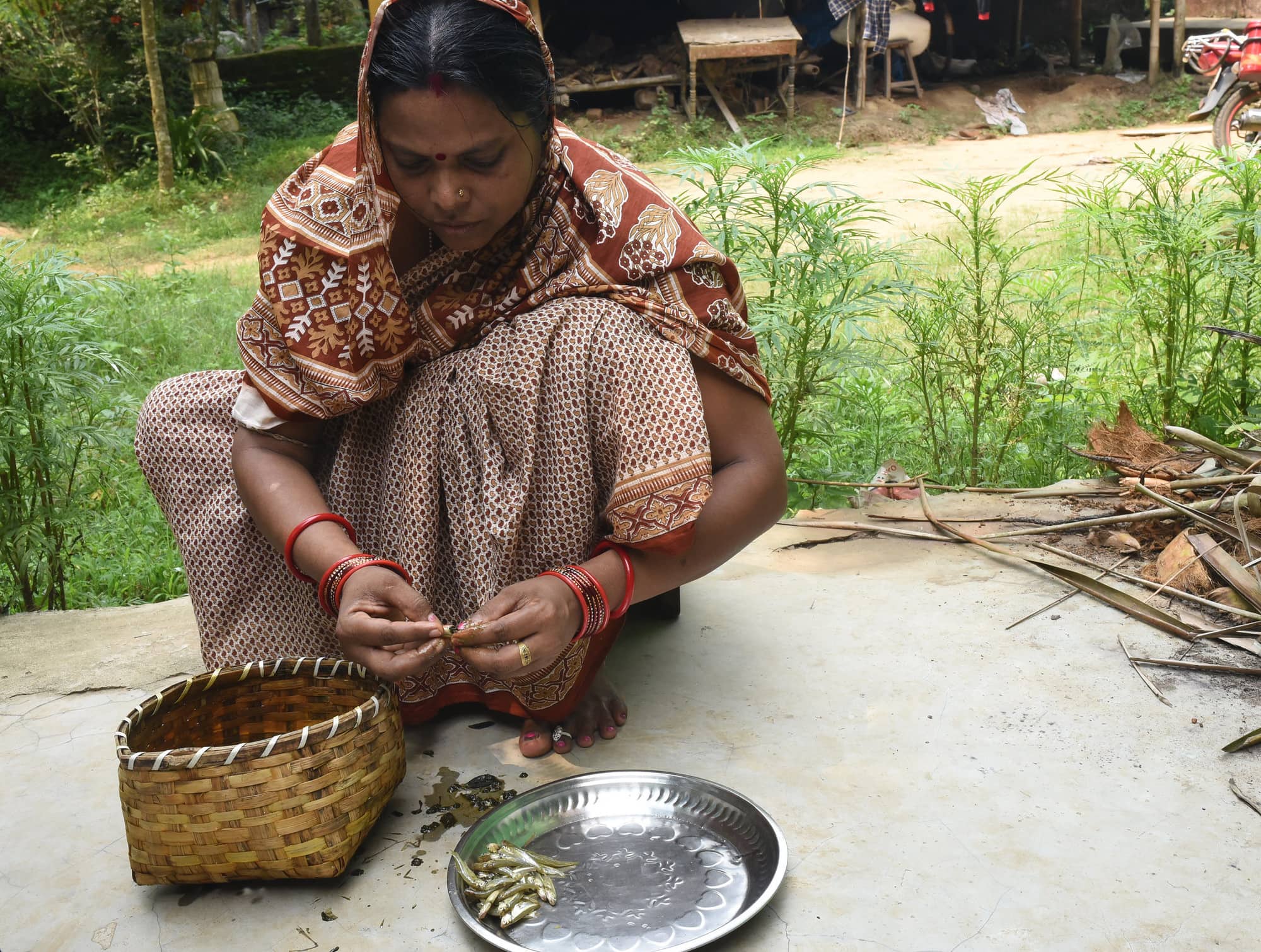 Urebashi Mallick prepares fresh mola in Gobindpur village Odisha India