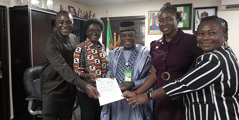 Jubilant IITA delegation with the NBC Director-General; L-R: Godwin Atser, Beatrice Aighewi, NBC DG Balarabe Shehu Ilelah, Ezinne Ibe, Terngu Abur.