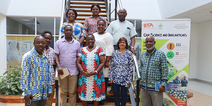 Hon Neema Lugangira (in white) with IITA and ILRI staff.