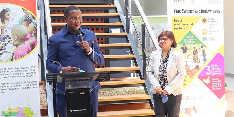 Tanzania’s Agriculture Minister, Hon. Prof Adolph Mkenda addressing IITA staff during the visit. Looking on is Leena Tripathi, IITA-EA Director.