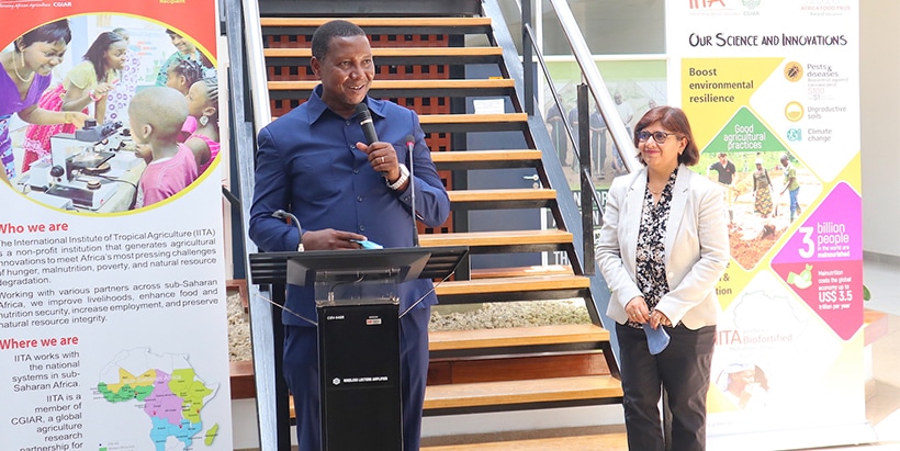 Tanzania’s Agriculture Minister, Hon. Prof Adolph Mkenda, addressing IITA staff as IITA-EA Director Leena Tripathi looks on.