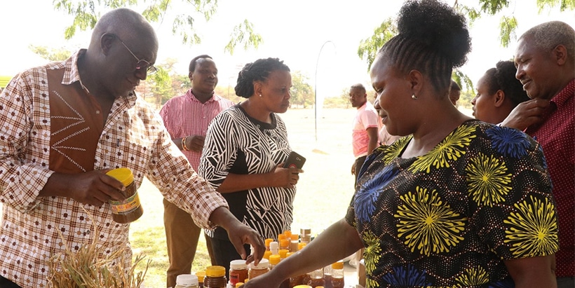 Africa RISING Chief Scientist, Prof. Mateete Bekunda visiting the exhibition booth at the event. Photo credit.E.Massam/IITA