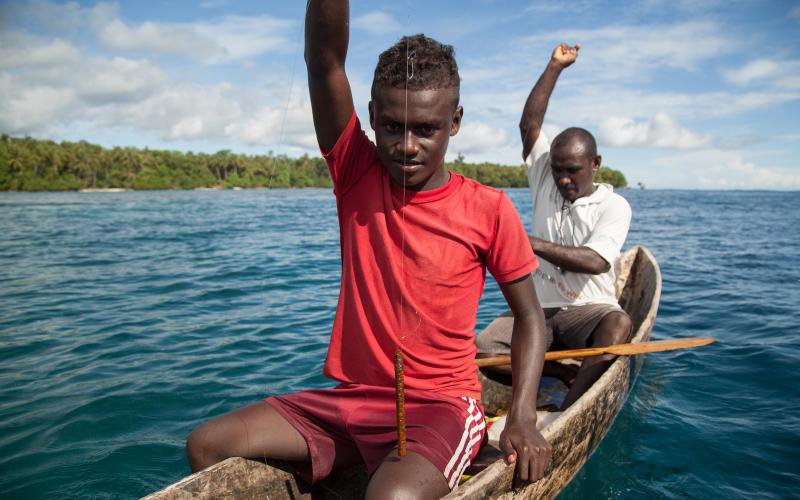 Men prepare to drop their fishing lines, Santupaele village, Western Province, Solomon Islands. Photo by Filip Milovac