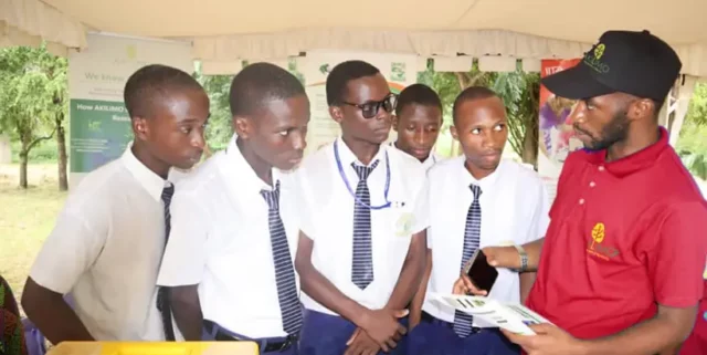 ACAI Agronomist Ali Ng’adoa (right) providing insight about AKILIMO technology to students. Photo: IITA/H. Rashid