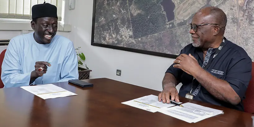 NAGGW Executive Director Dr Yusuf Bukar (left) discussing with IITA DDG-Special Duties Dr Kwame Akuffo-Akoto.