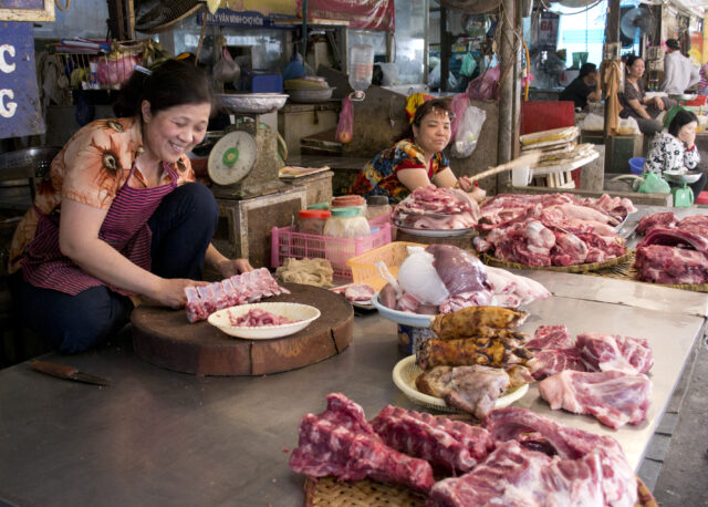 Stall owners watch over their pork and beef stock in a local wet market, Hanoi, Vietnam (photo credit: ILRI/Andrew Nguyen).