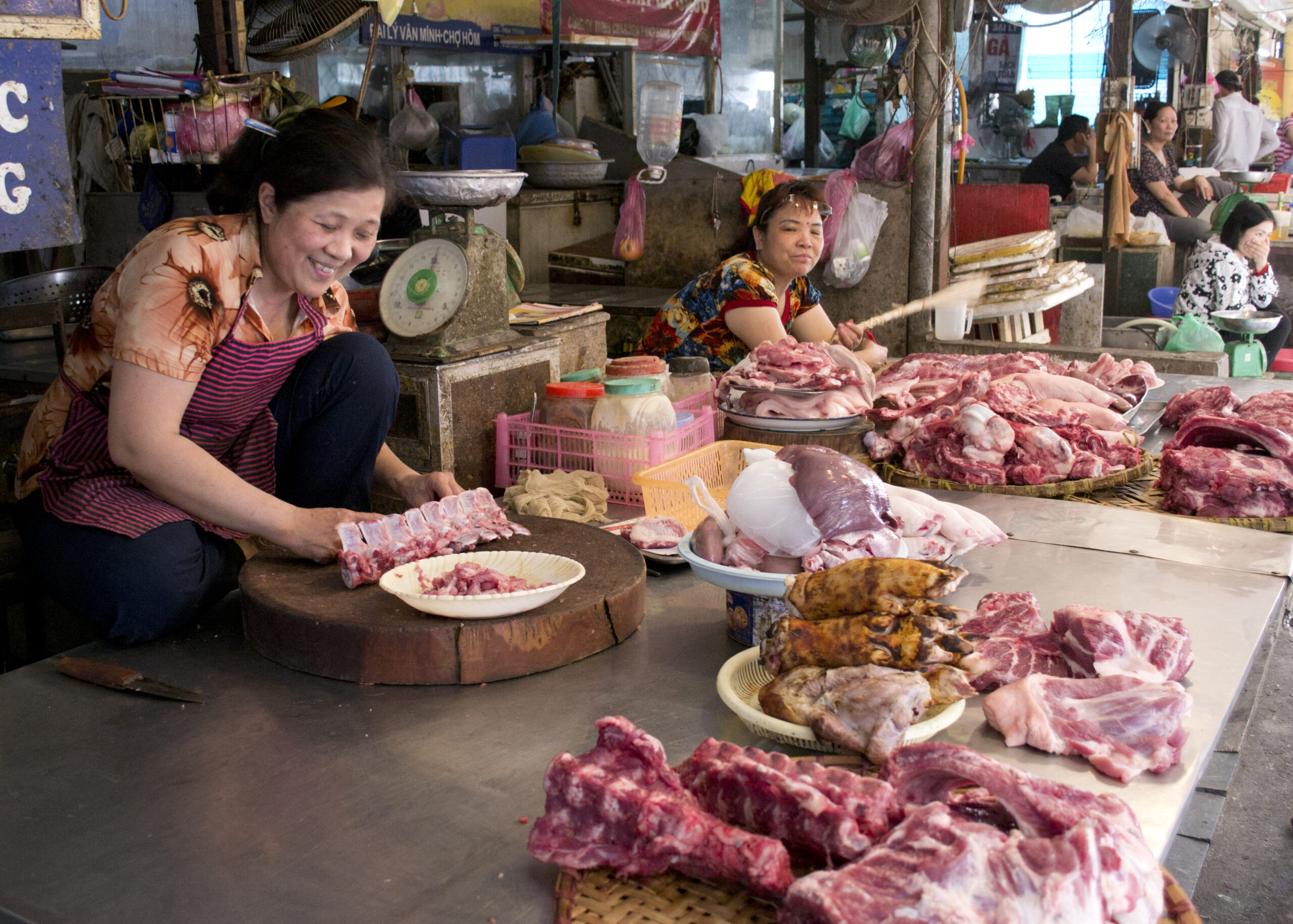 Stall owners watch over their pork and beef stock in a local wet market, Hanoi, Vietnam (photo credit: ILRI/Andrew Nguyen).