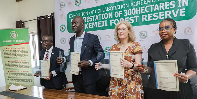 Permanent Secretary Rotimiolu Akinlesi, Commissioner for Forestry Engr Taiwo Oludotun, IITA DDG-CS Hilde Koper-Limbourg, and IITA Head of Legal Services Morenike Abu displaying copies of the signed MoU between IITA Forest Center and the Ogun State Ministry of Forestry