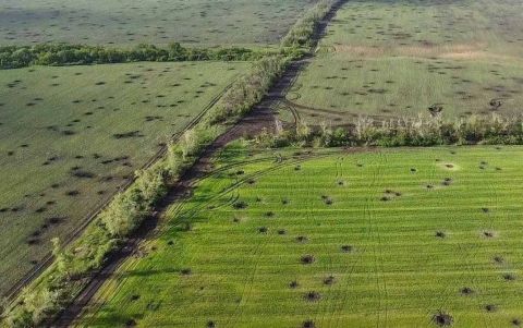 Field in Ukraine with artillery craters