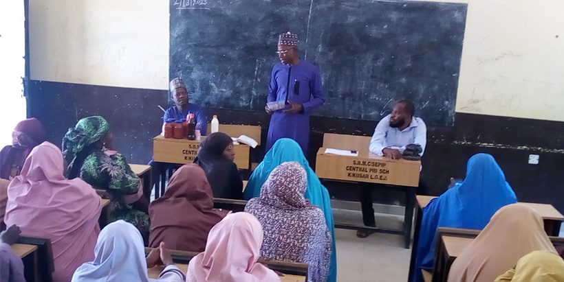 USAID MELSA team member, Professor John Jiya Musa, assessing the Tomapepo product (a mix of tomato, pepper, and onions) made by the Activity’s beneficiaries in Kwaya Kusar LGA, Borno State.