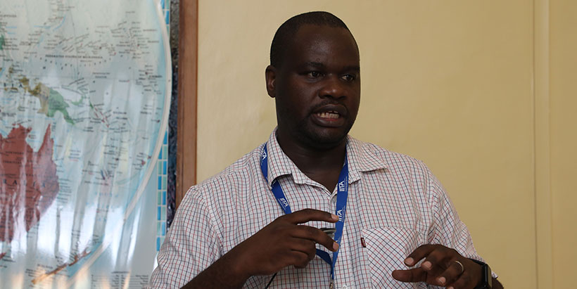 IITA Product Manager for Grain Crops, Dean Muungani, anchoring the meeting