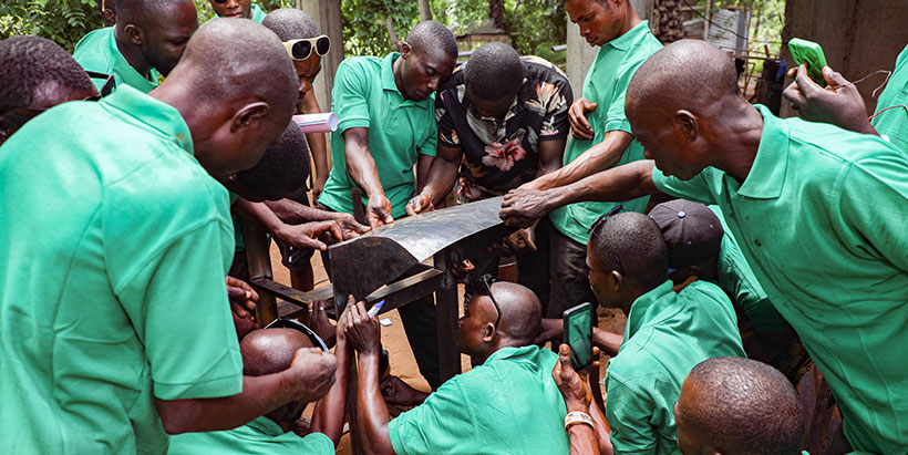 Trainees learning about the machine’s parts.