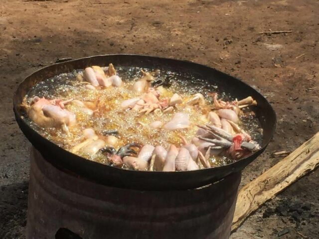 Deep frying of chicken at a market in Ouagadougou, Burkina Faso (photo credit: ILRI/Michel Dione).