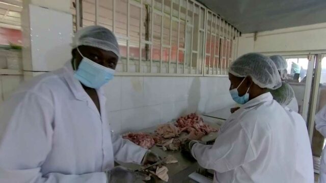 YABIC-members-processing-pork-meat-for-sausage-production.