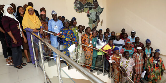 The IITA PROSSIVA team with the farmers.