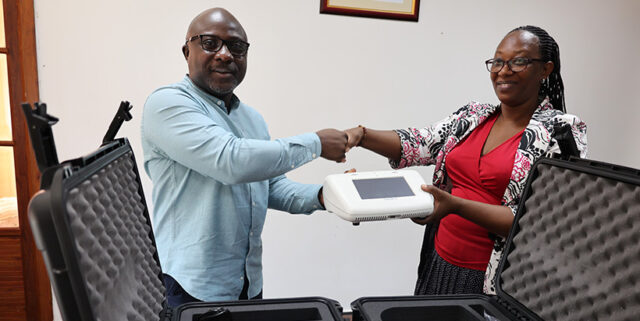 IITA Country Representative Konlambigue Matieyedou handed over the LAMP devices to RICA DG Beatrice Uwumukiza.