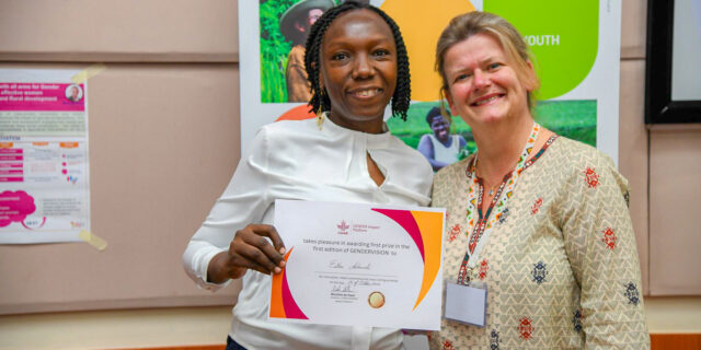 Esther Achandi receiving her award from Nicoline de Haan, CGIAR GENDER Platform director (ILRI / Nathan Ronoh).