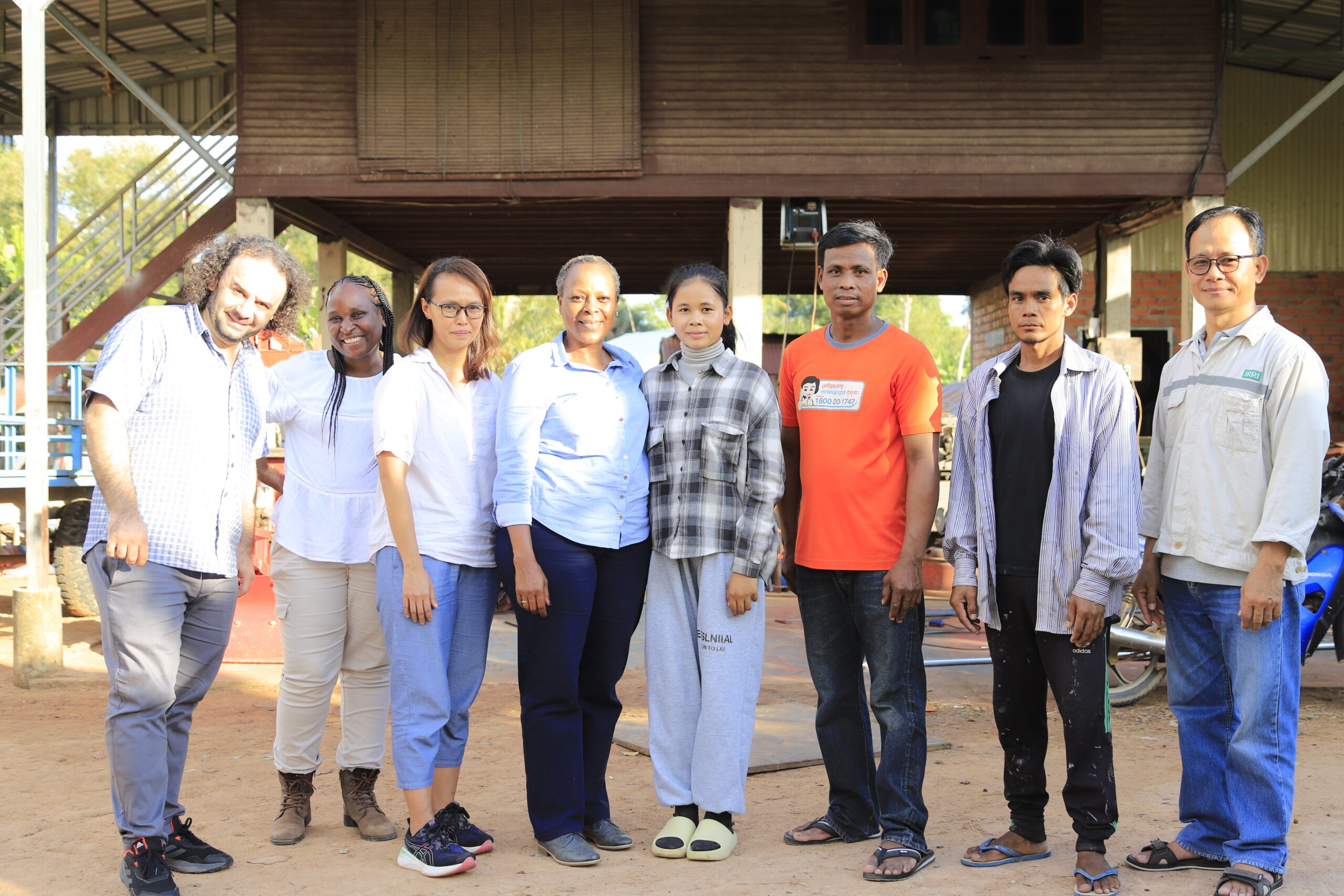 Wanjiku and the Excellence in Excellence in Agronomy team. In the picture: Murat SARTAS (Ph.D.), Wanjiku Guchu, Rica Flor, Barbra Sehlule Muzata, and rathmuny alongside Mr Lun Heng, a Cambodian farmer and his family.