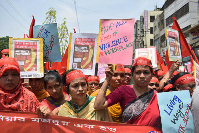 Bangladeshi women protesting with signs.