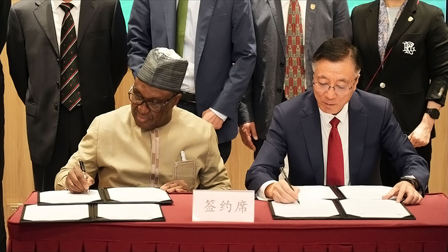 Qixin Sun, President CAU and Dr Simeon Ehui, IITA Director General signing the MoU in China.