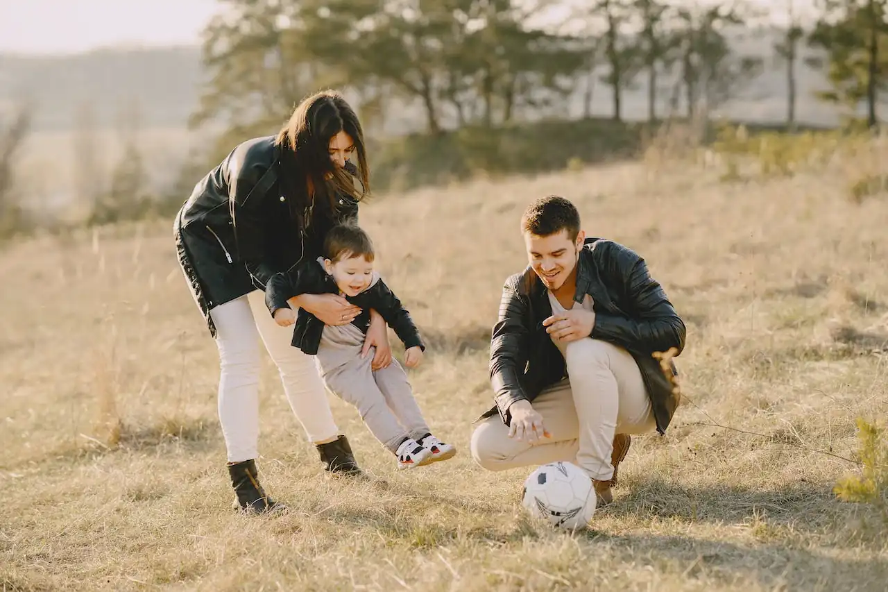 family playing soccer.webp