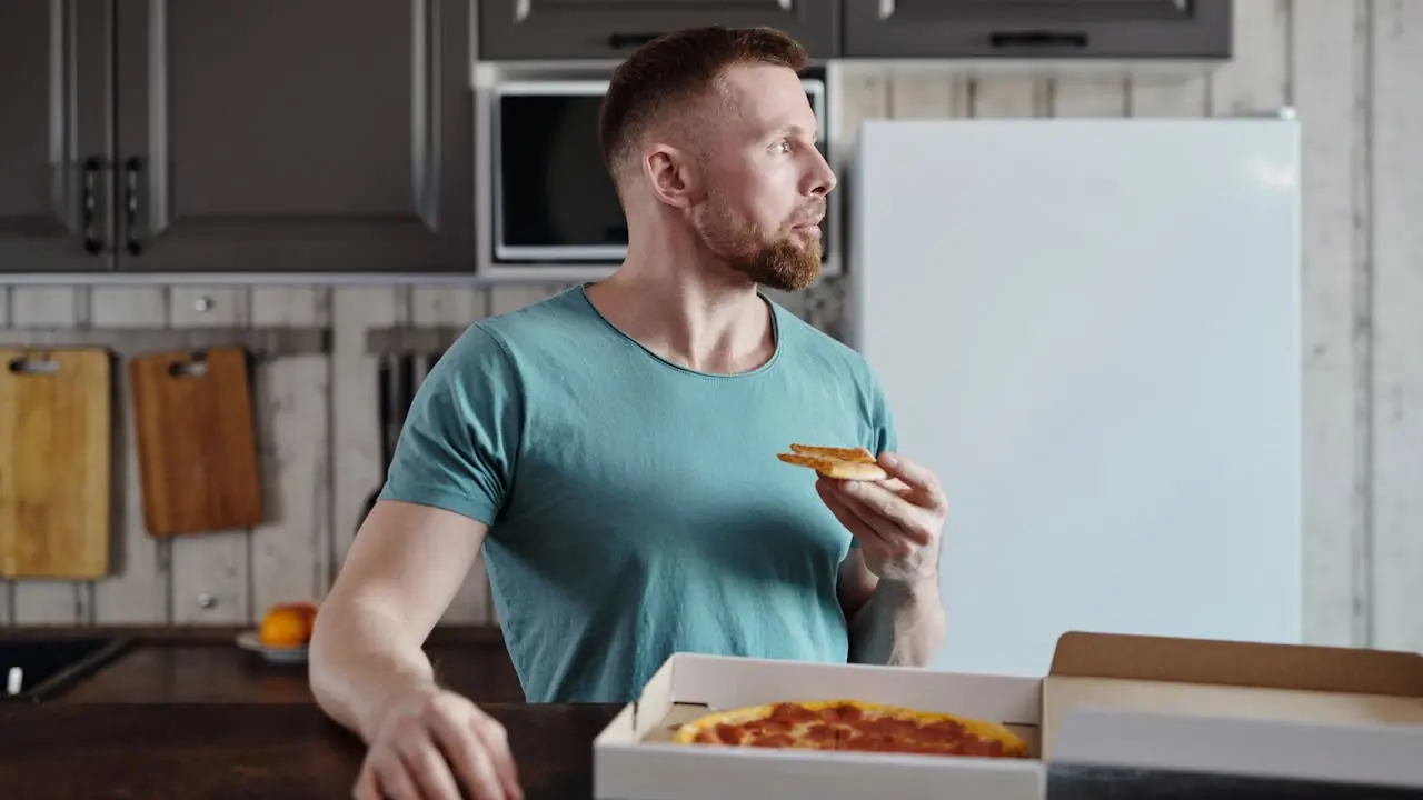man eating pizza.webp