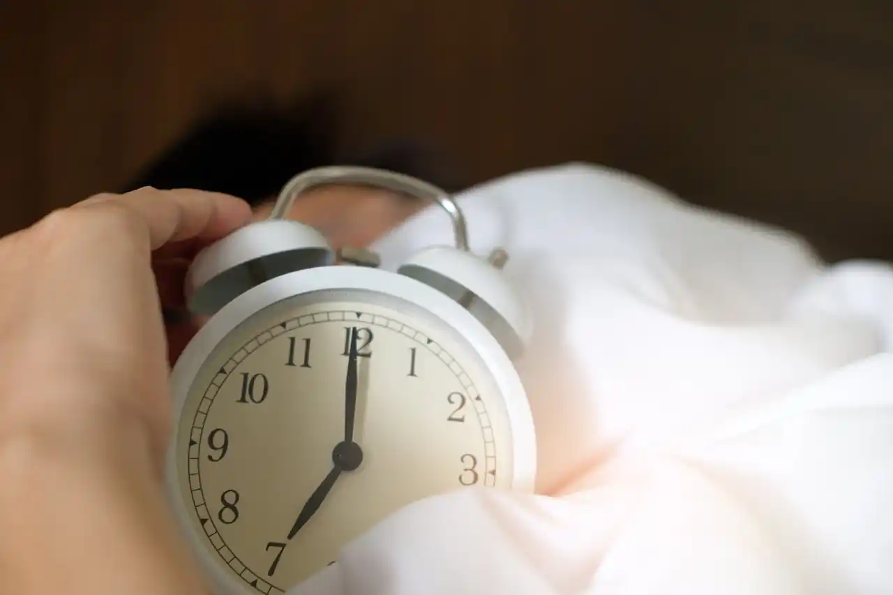 sleeping alarm clock.webp