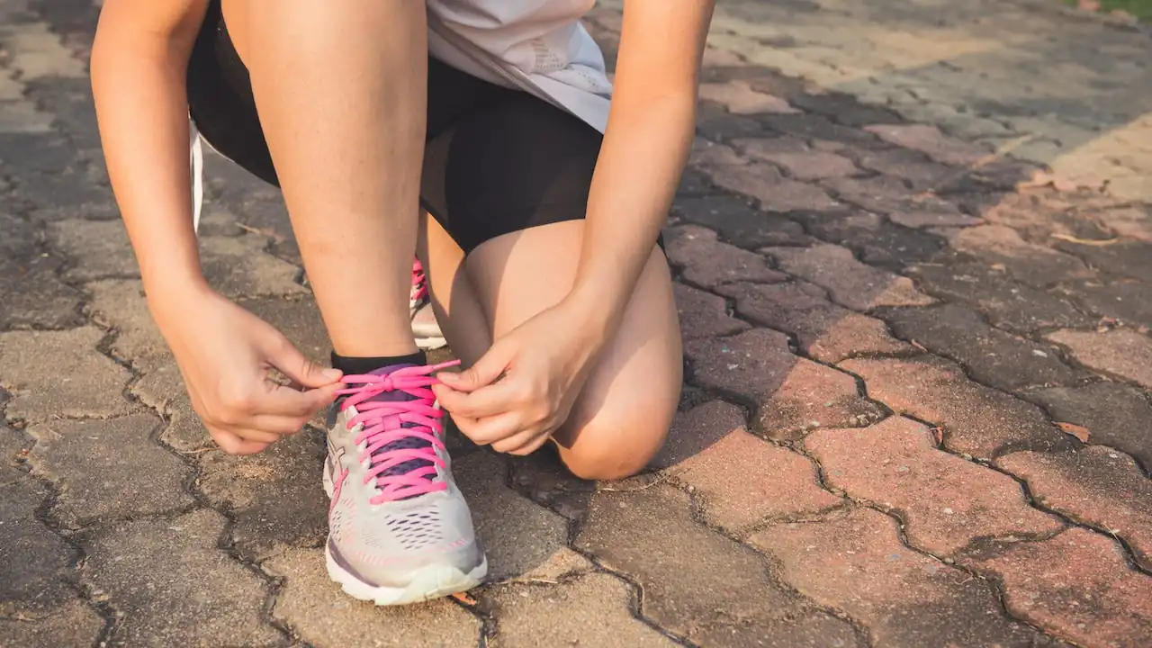 Women tying shoes ready to exercise