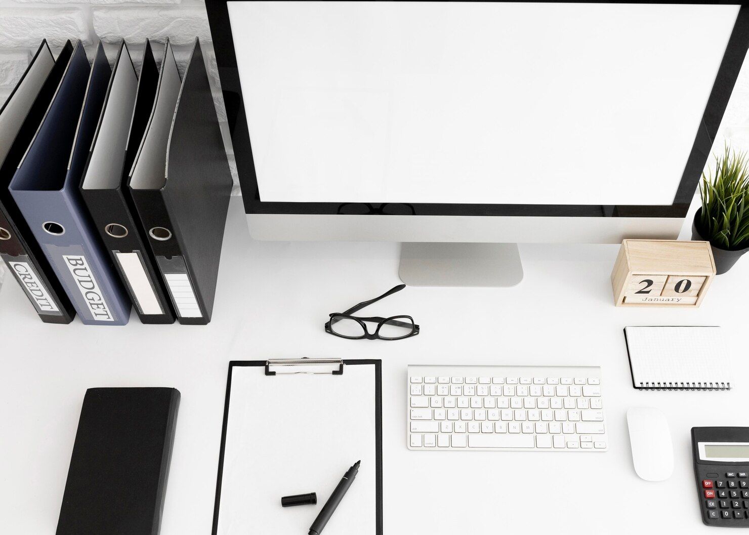 high-angle-office-desk-with-computer-screen-clipboard_23-2148821881.jpg