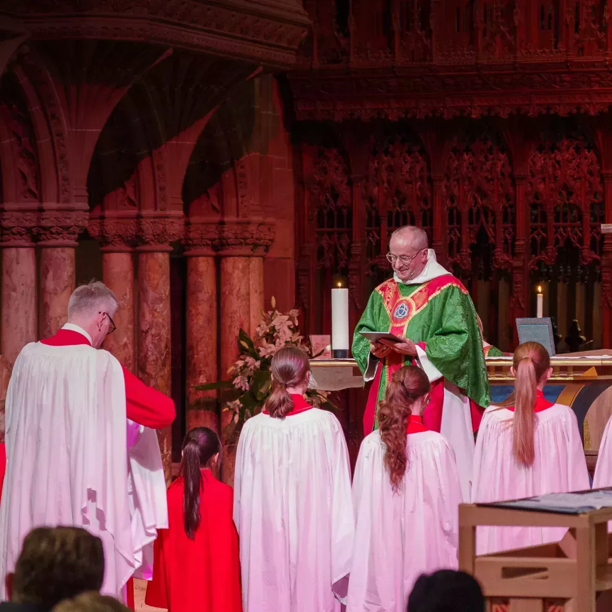 Photograph of the The Dean, the Very Revd Dr Tim Stratford delivering Holy Communion.