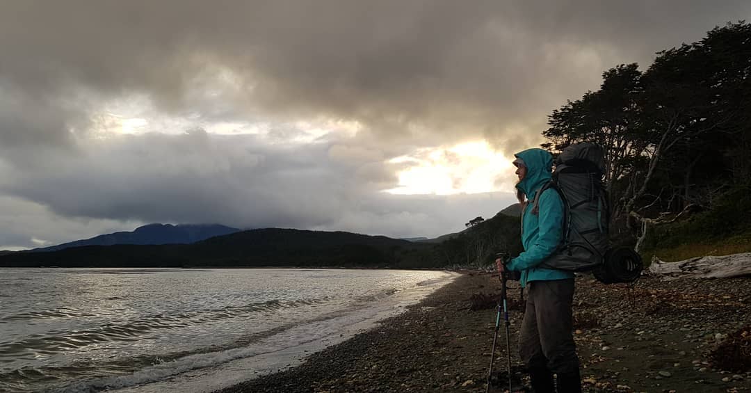 Woman looking at the Strait of Magellan, Cape Froward Heritage Route.