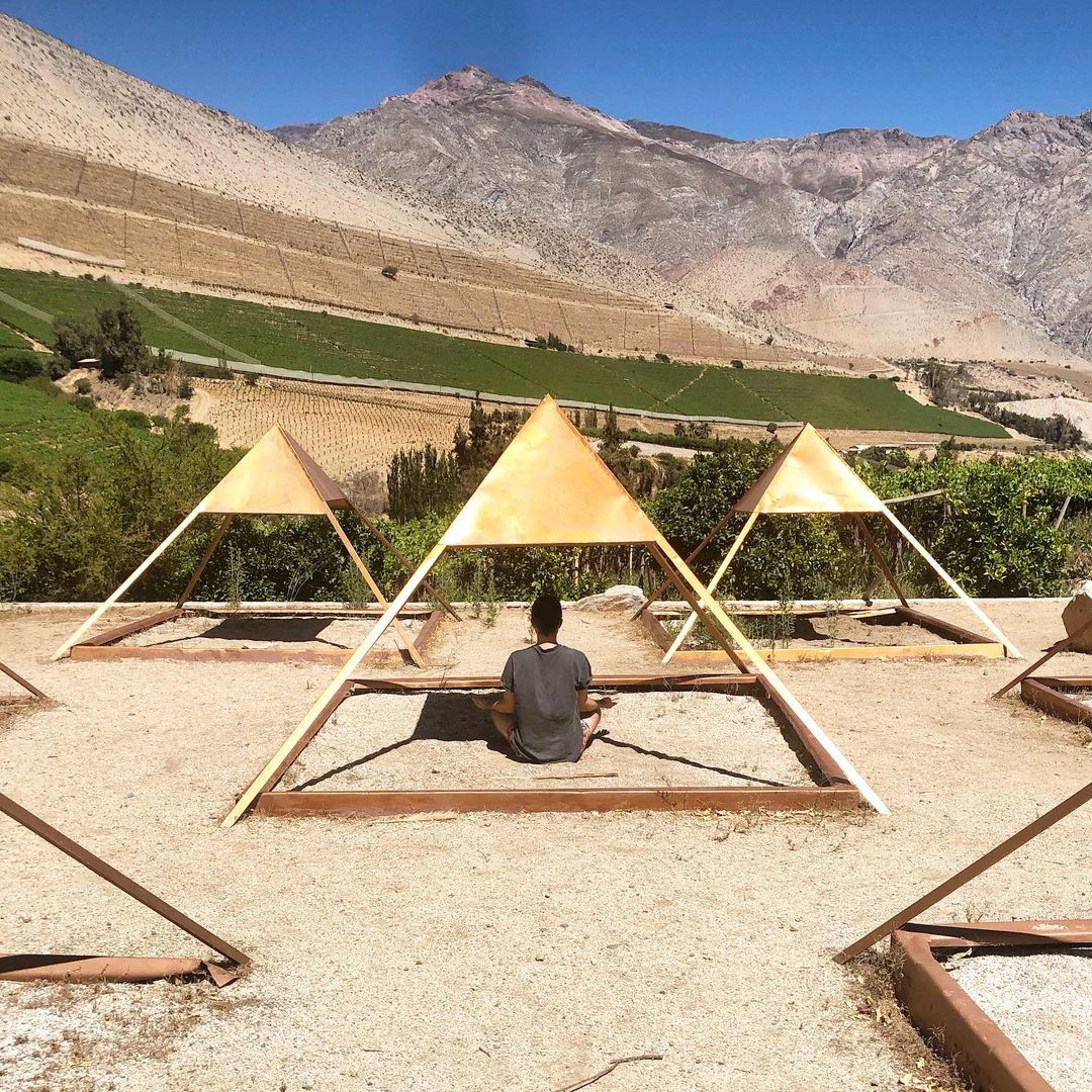 Man meditating by the pyramids of Cochiguaz, Elqui Valley