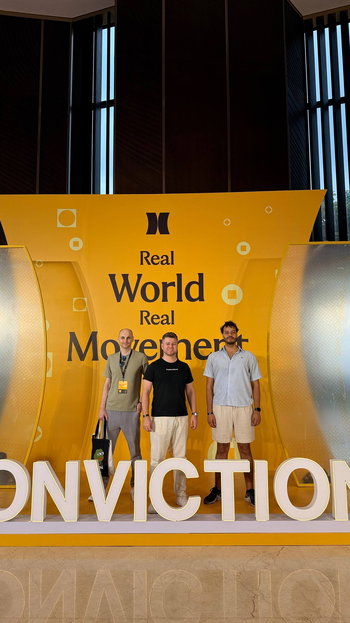 CryptoJobsList team at the Conviction 2026 backdrop in Ho Chi Minh City