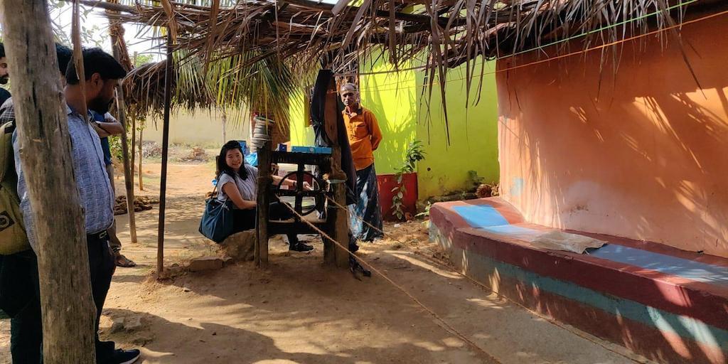 Elisa Lai visiting a village in Karnataka where they now use a motorized rope making machine powered by solar, displacing the labor intensive manual machine featured here