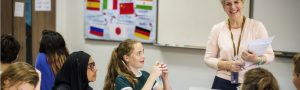 Group of diverse high school students studying in class