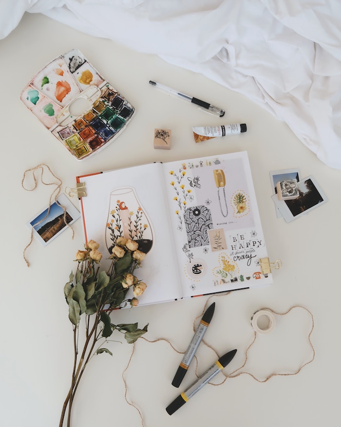 flatlay photography of scrapbook on white surface