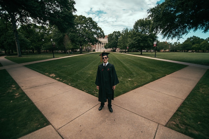 Graduate standing on pathway