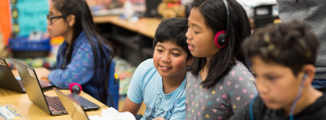 Student reading together on laptop