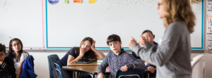 Teacher talking to focused students