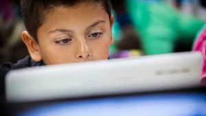 Student in front of his laptop