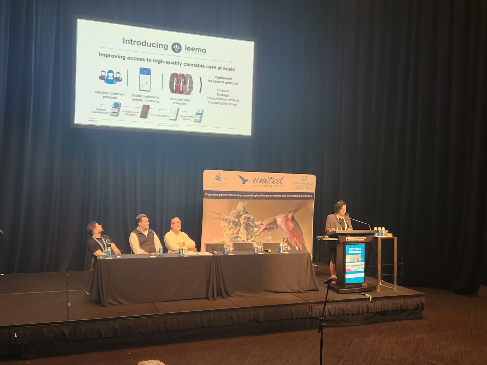 Our head nurse presenting at the United in Compassion conference in Brisbane, August 2023 logo