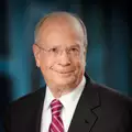 Jack M. Greenberg logo
