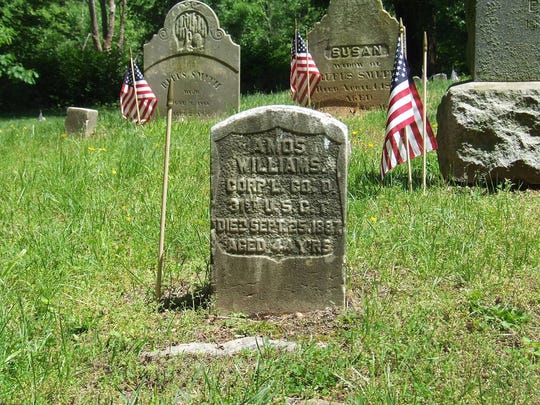 The tombstone of Corporal Amos Williams, who served in the Civil War.
