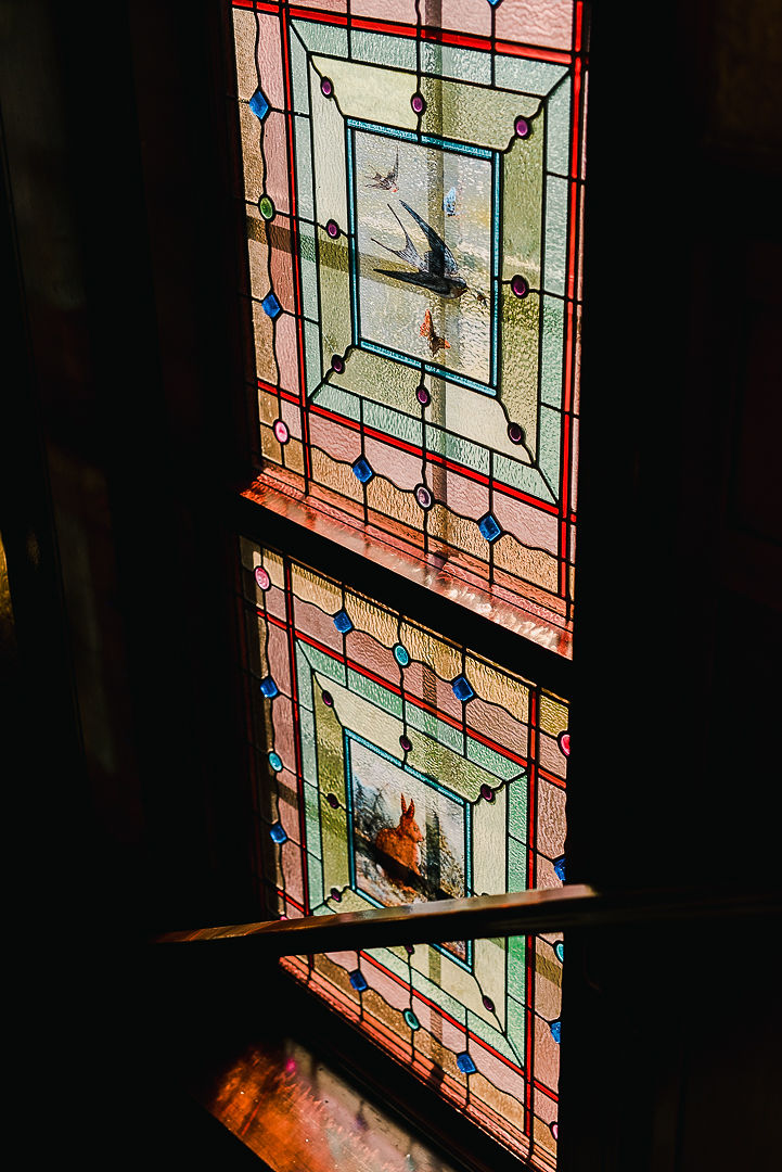 Image 3, Stained Glass as you are walking up the stairs