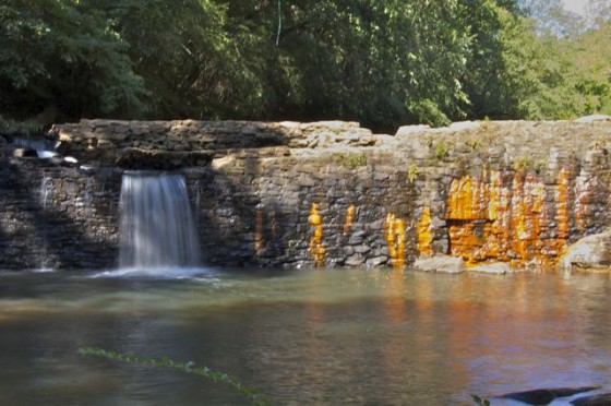 The site also features a waterfall and a pond.