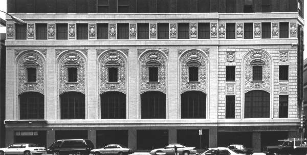 Richly modeled, Renaissance ornament in terra cotta on the lower stories and cornice.