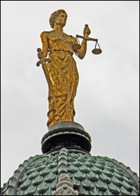 On top of the copper shingles of the cupola is a bronze statue of Justice. The statue was part of the building's original plan but was not par of the building until renovations in 1988.